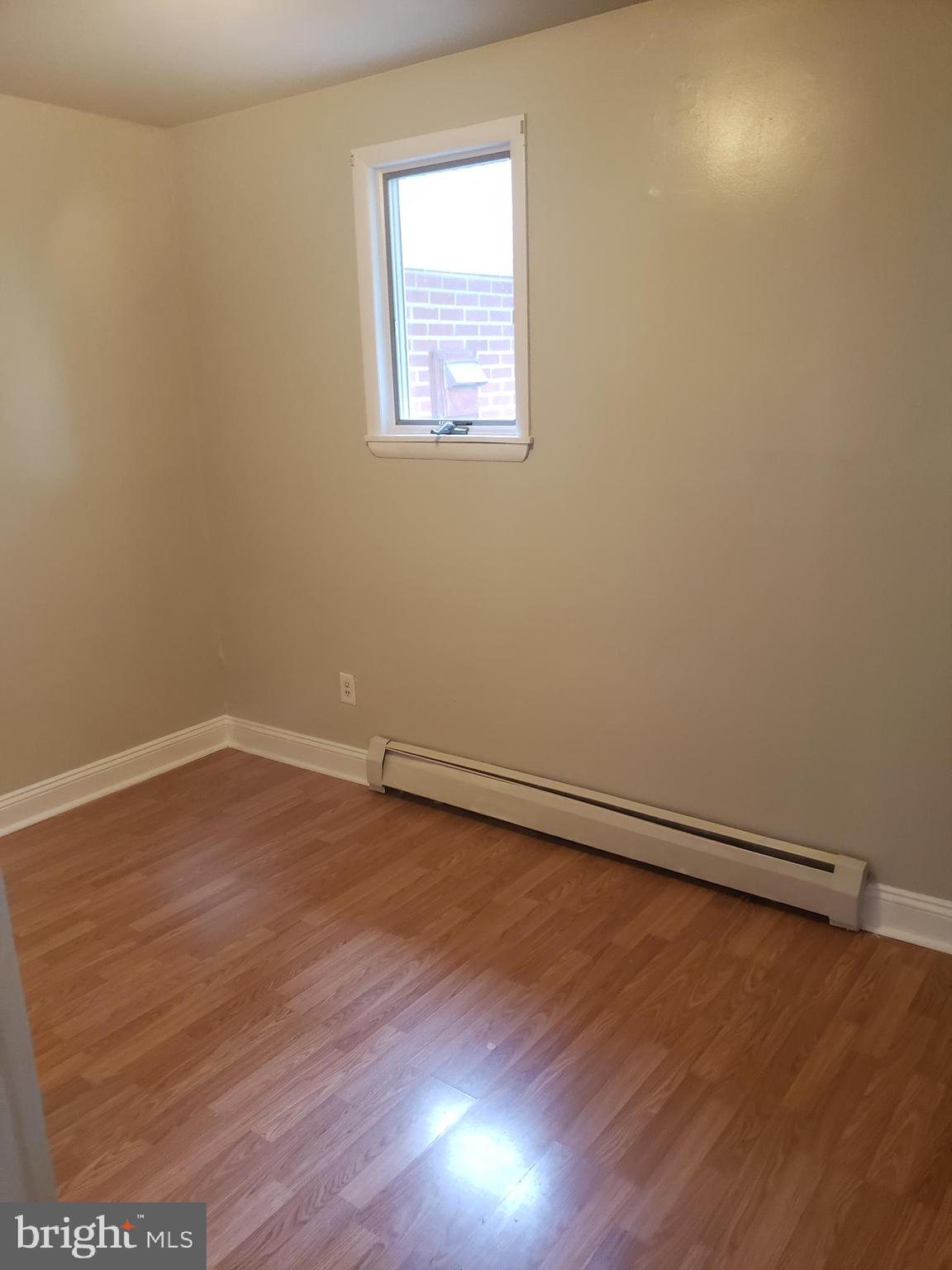 220 Franklin Road Glassboro, NJ 08028 - Photo 31 of 40 a view of an empty room with wooden floor and a window