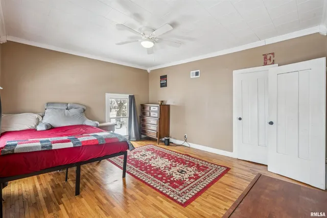 a view of a bedroom with furniture and rug