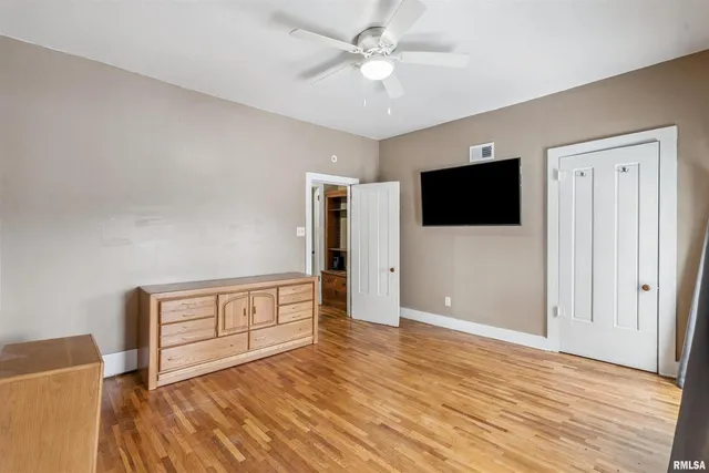 a view of a livingroom with wooden floor