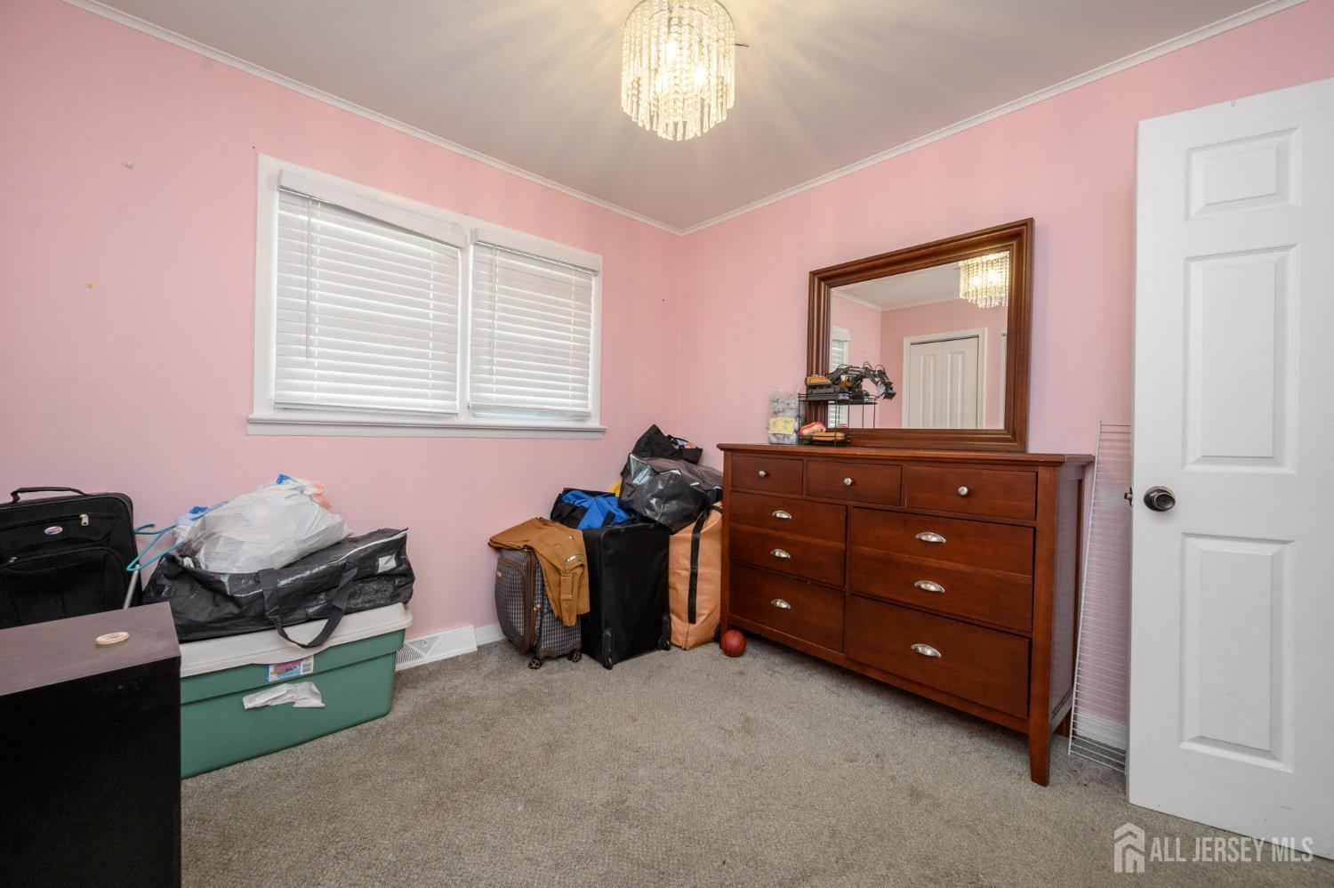384 Cook Road Jackson, NJ 08527 - Photo 19 of 31 a room with a dresser and a window