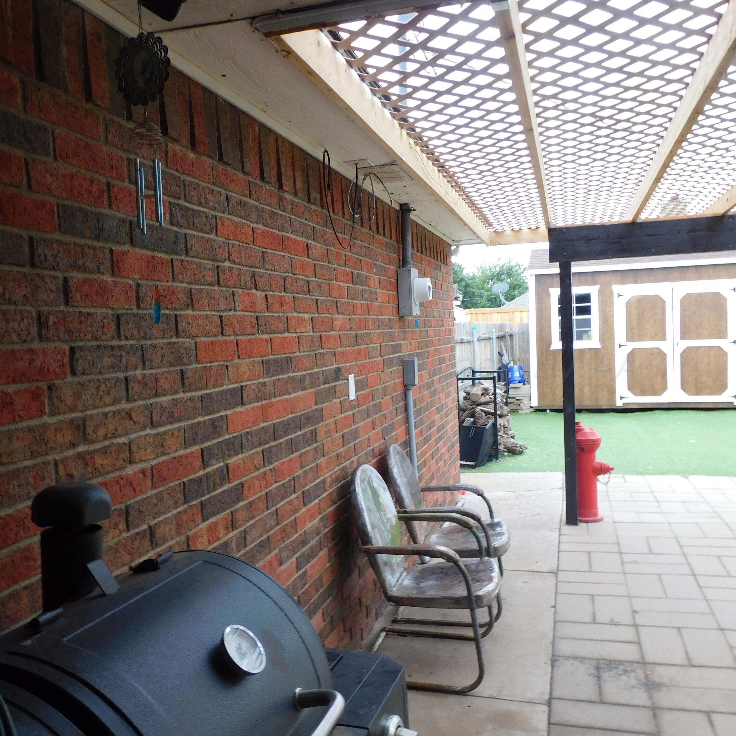 2201 Troveta Drive Amarillo, TX 79110 - Photo 30 of 33 a backyard of a house with seating space