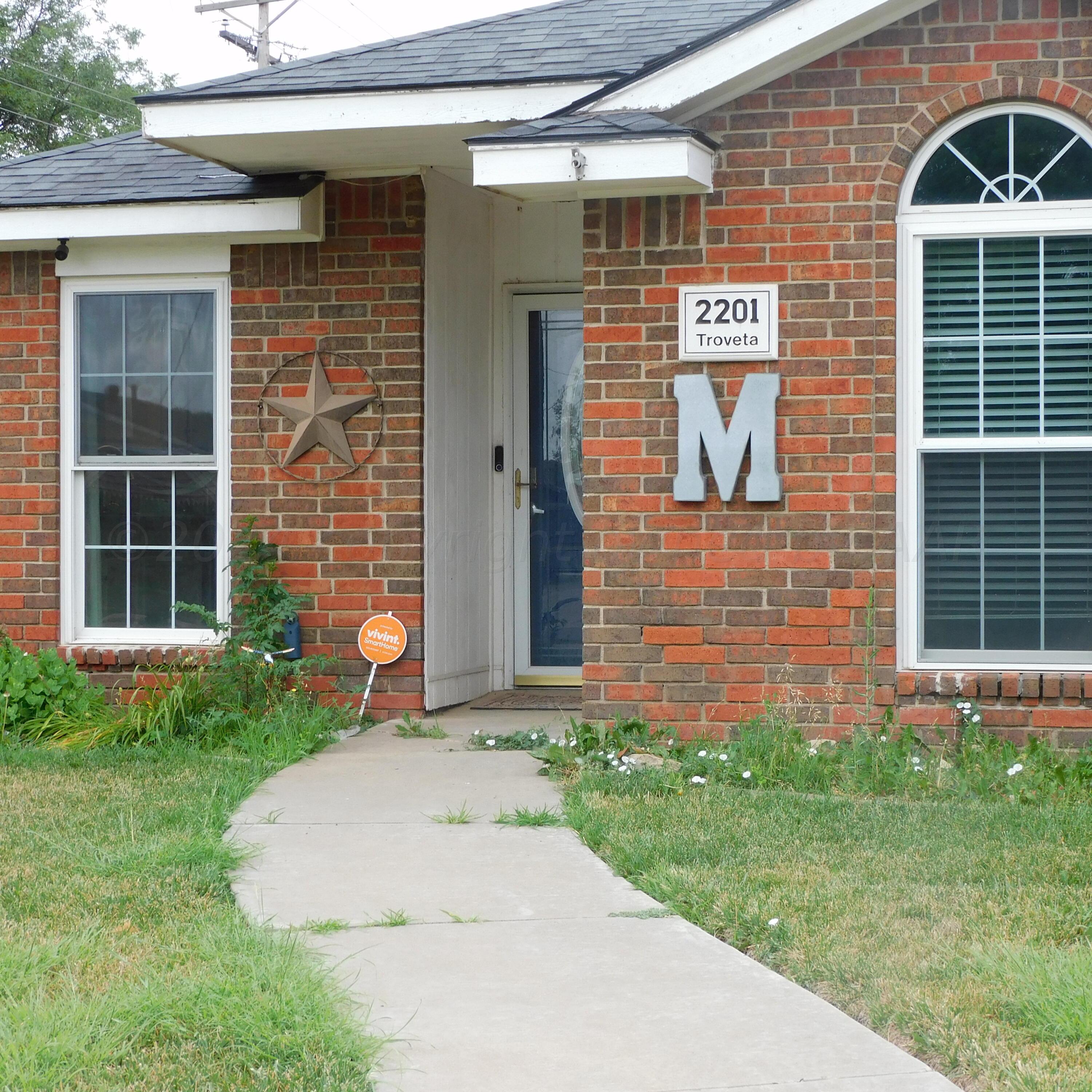 2201 Troveta Drive Amarillo, TX 79110 - Photo 4 of 33 a front view of a house with a yard