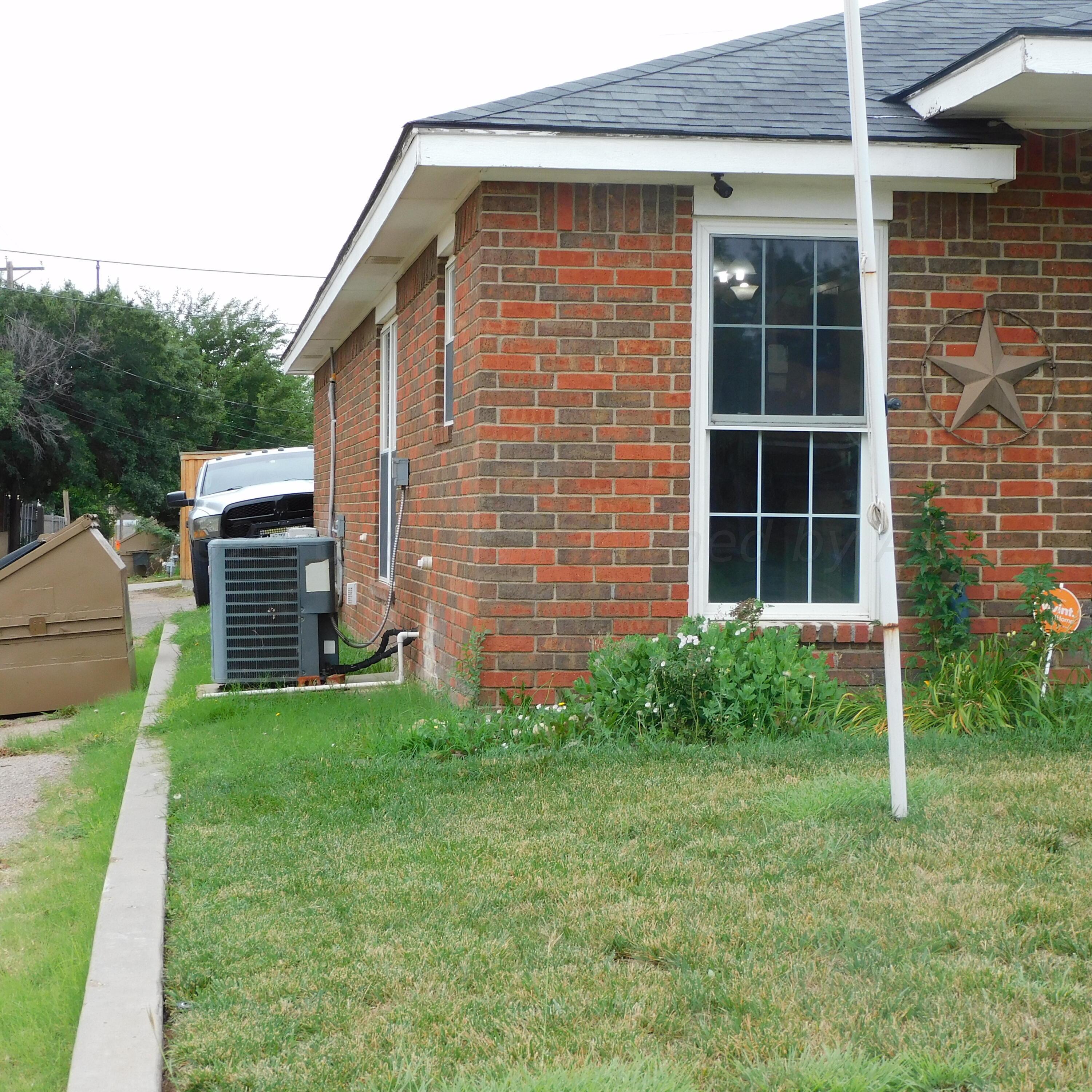 2201 Troveta Drive Amarillo, TX 79110 - Photo 5 of 33 a front view of a house with garden