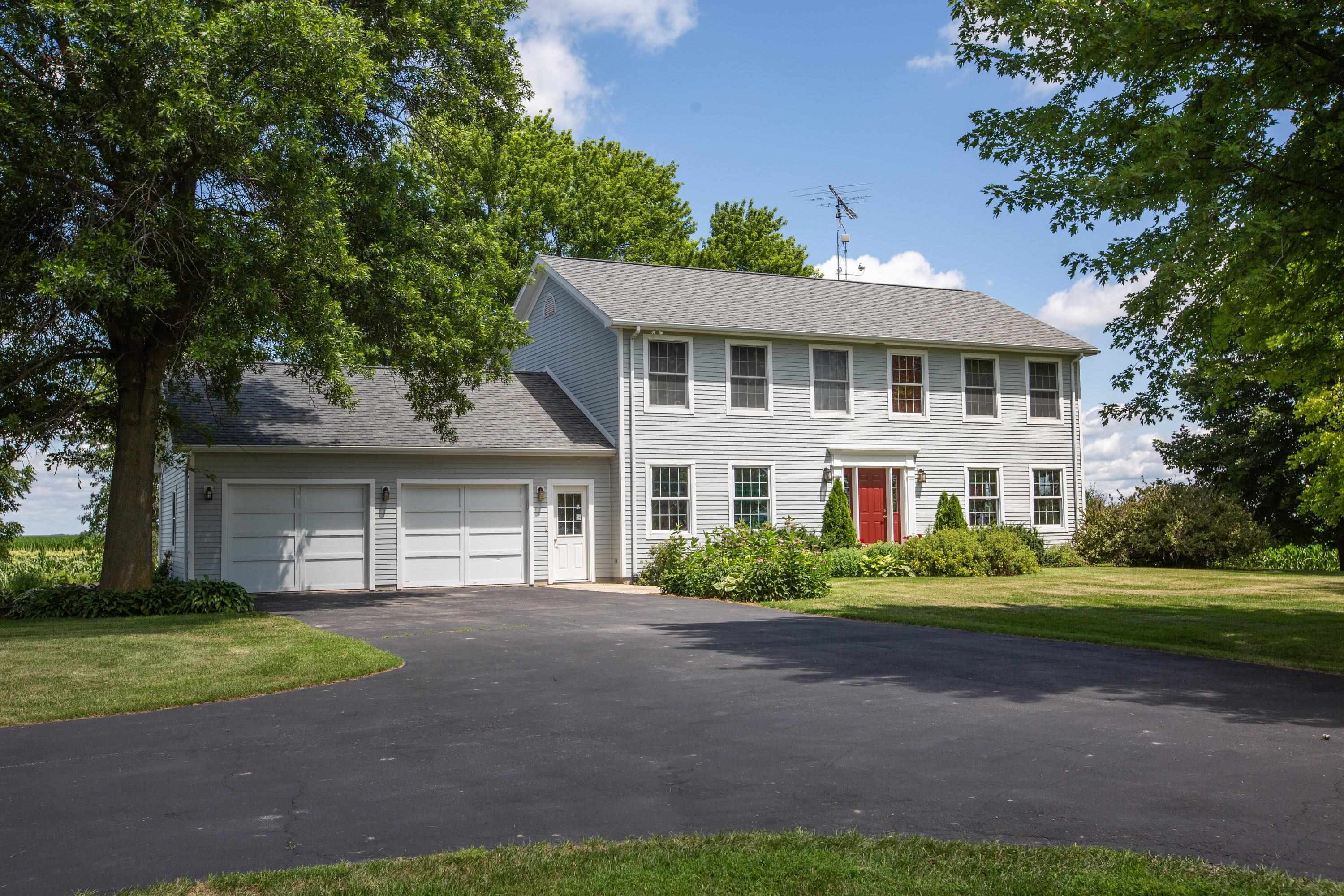 17092 Blackhawk Road Shullsburg, WI 53586 - Photo 1 of 50 a front view of a house with a garden