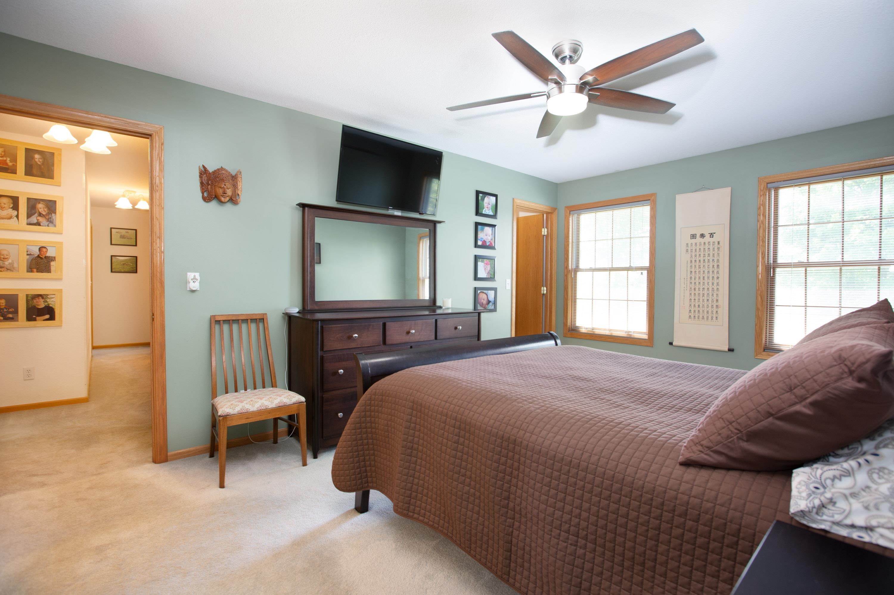 17092 Blackhawk Road Shullsburg, WI 53586 - Photo 22 of 50 a bedroom with a bed a couch and a flat screen tv
