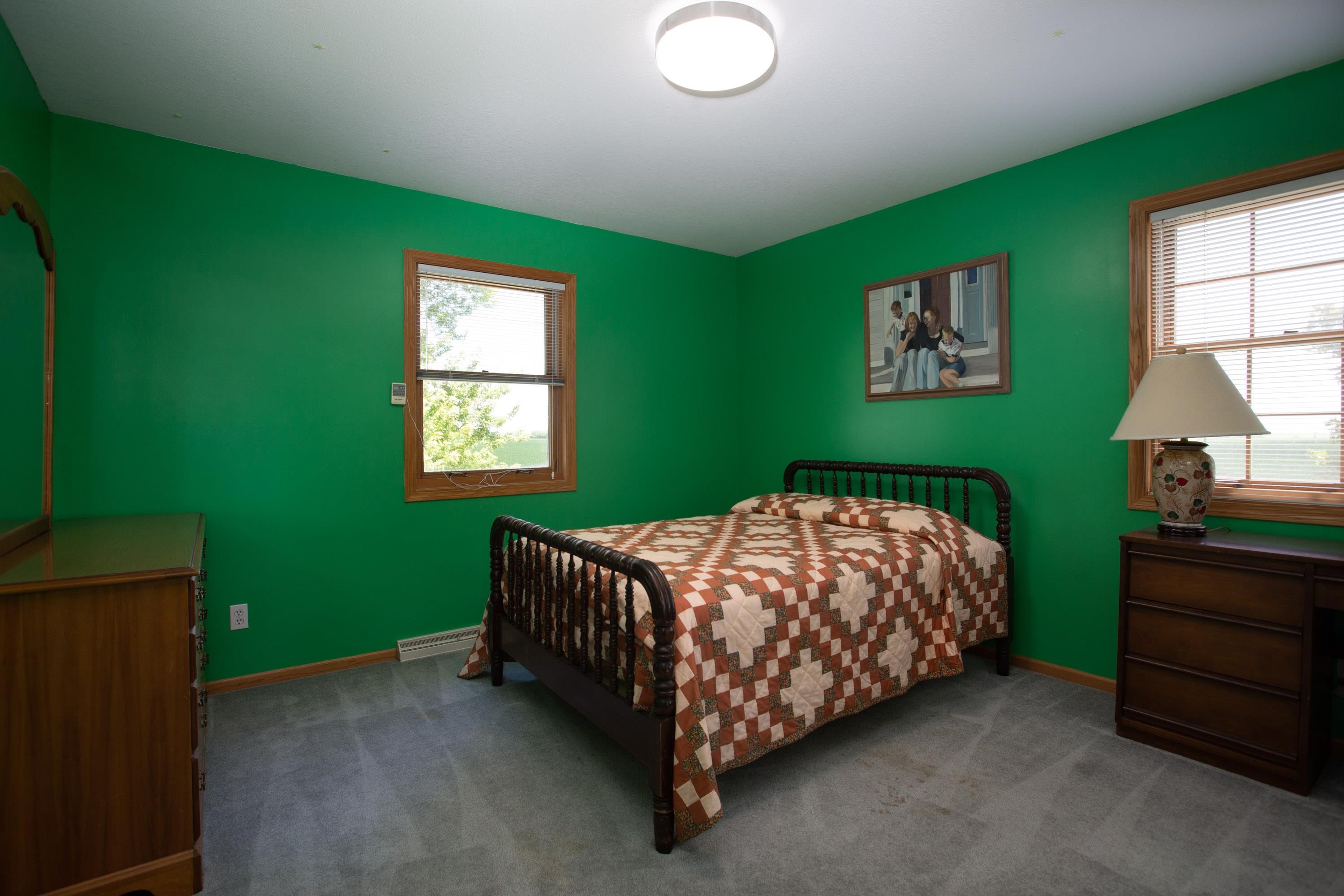 17092 Blackhawk Road Shullsburg, WI 53586 - Photo 28 of 50 a bed sitting in a bedroom next to a window