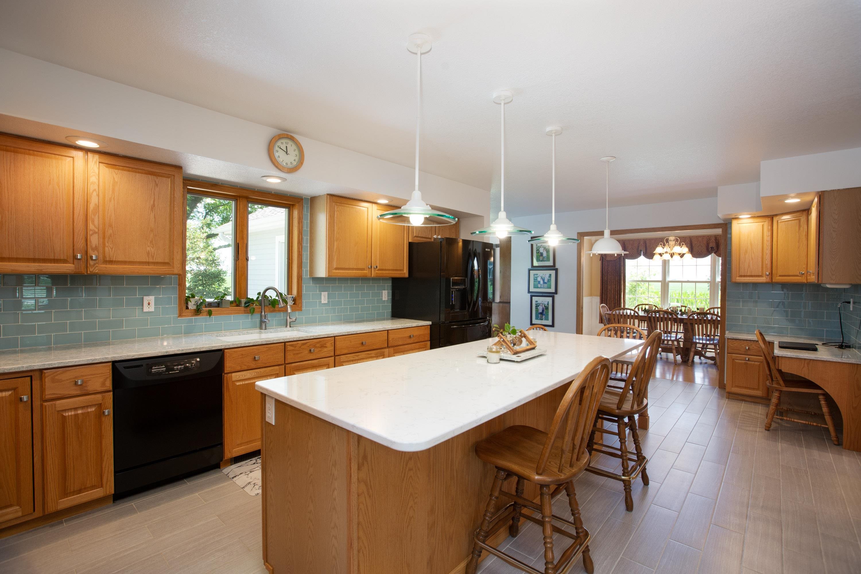 17092 Blackhawk Road Shullsburg, WI 53586 - Photo 5 of 50 a large kitchen with a table and chairs