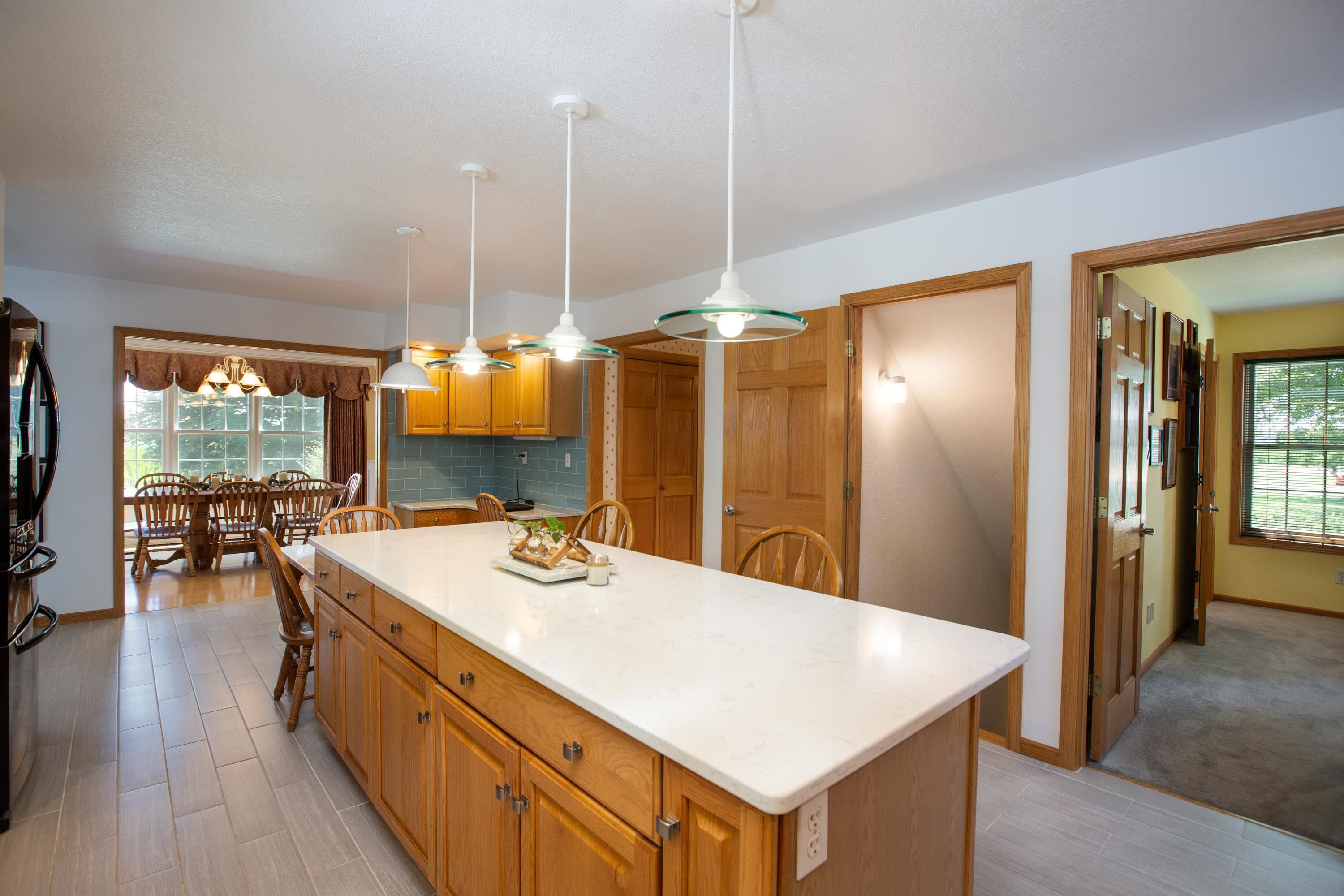 17092 Blackhawk Road Shullsburg, WI 53586 - Photo 6 of 50 a view of kitchen island a sink a table and chairs