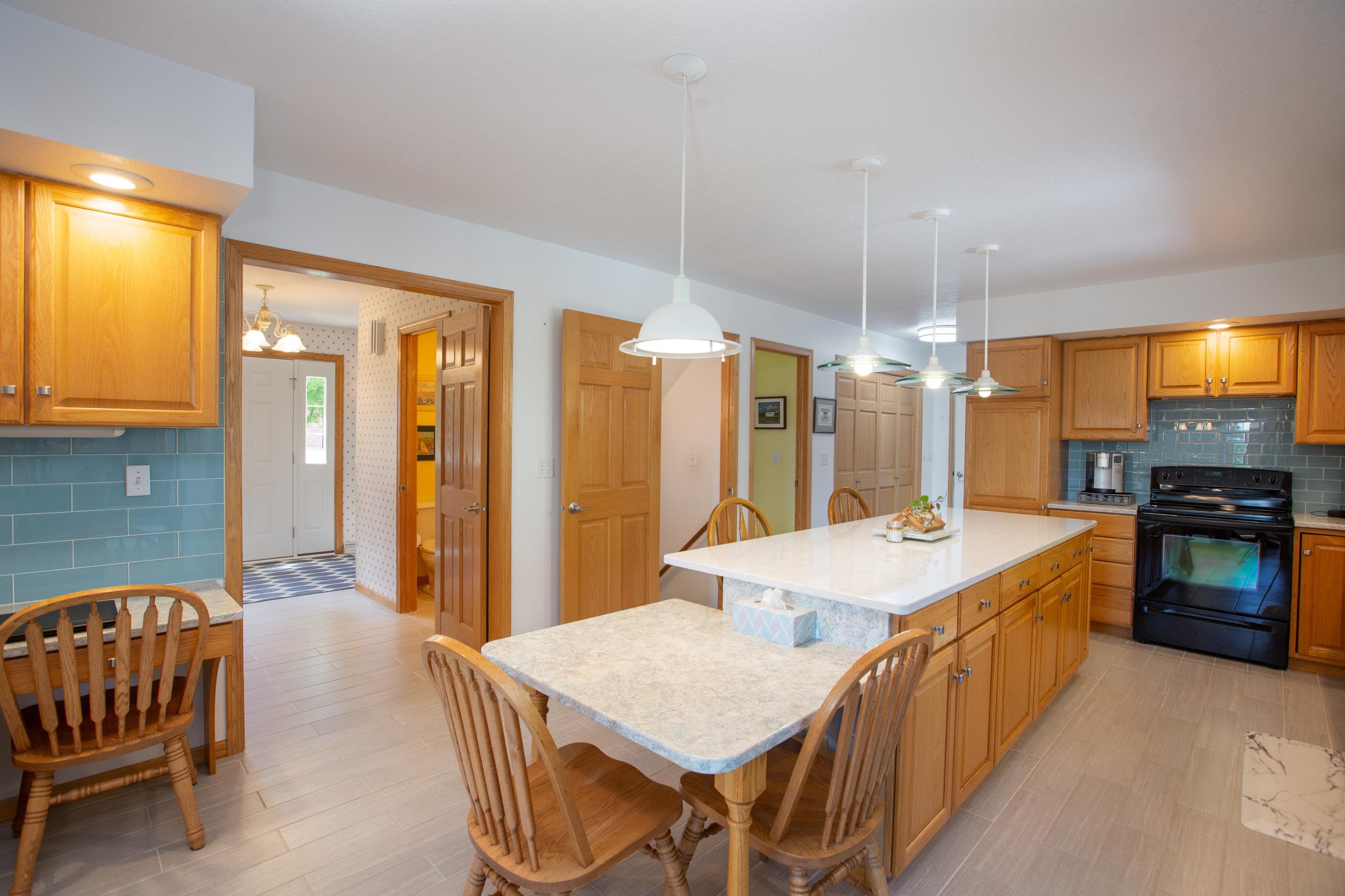 17092 Blackhawk Road Shullsburg, WI 53586 - Photo 8 of 50 a large kitchen with a table and chairs