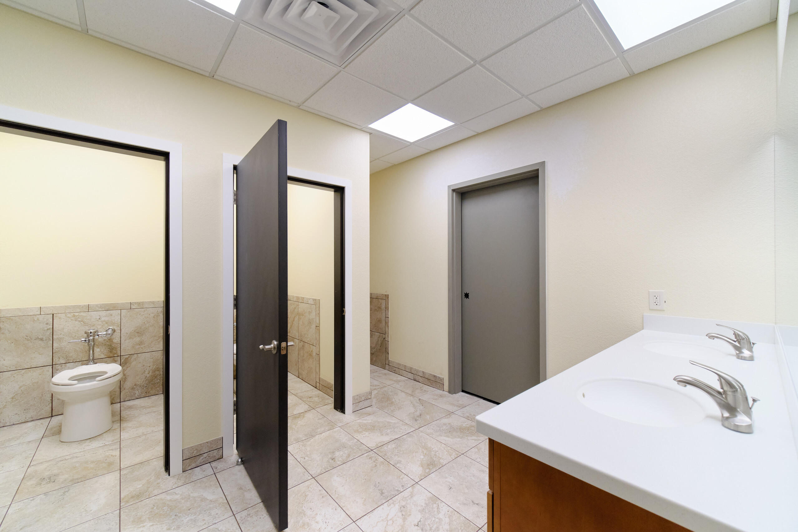 5859 Potter Road Onekama, MI 49675 - Photo 43 of 85 Men's w/2 stalls, urinal & 2 lavs