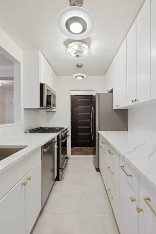 a view of a livingroom with furniture and window