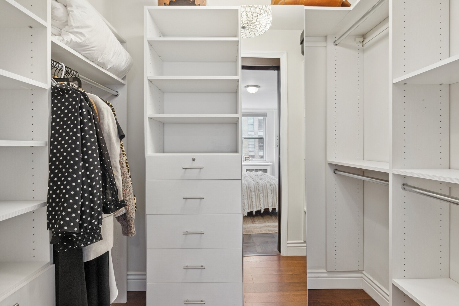 13 West 13th Street, Unit 7FS Manhattan, NY 10011 - Photo 7 of 11 a view of walk in closet with empty racks