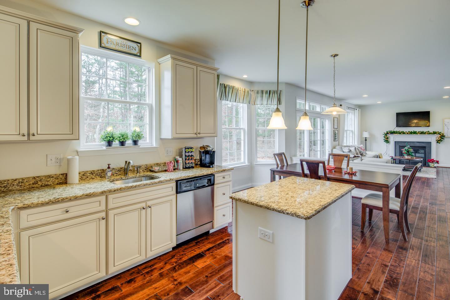20 Champlain Road Marlton, NJ 08053 - Photo 13 of 15 a kitchen with kitchen island granite countertop a stove a sink a center island and cabinets