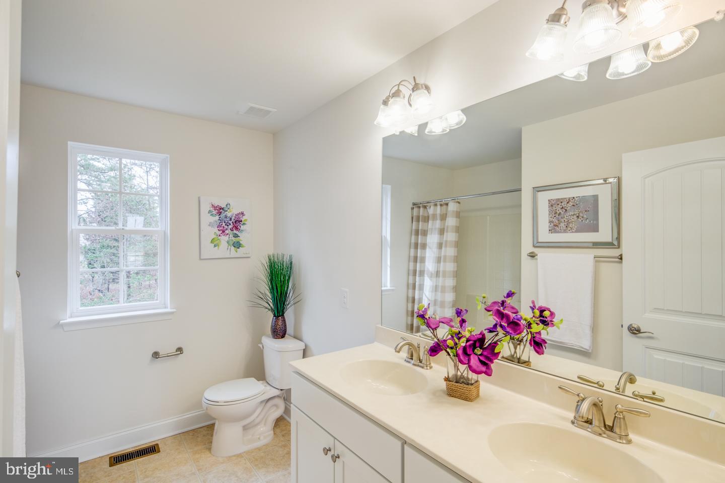 20 Champlain Road Marlton, NJ 08053 - Photo 7 of 15 a bathroom with a sink vanity mirror and toilet