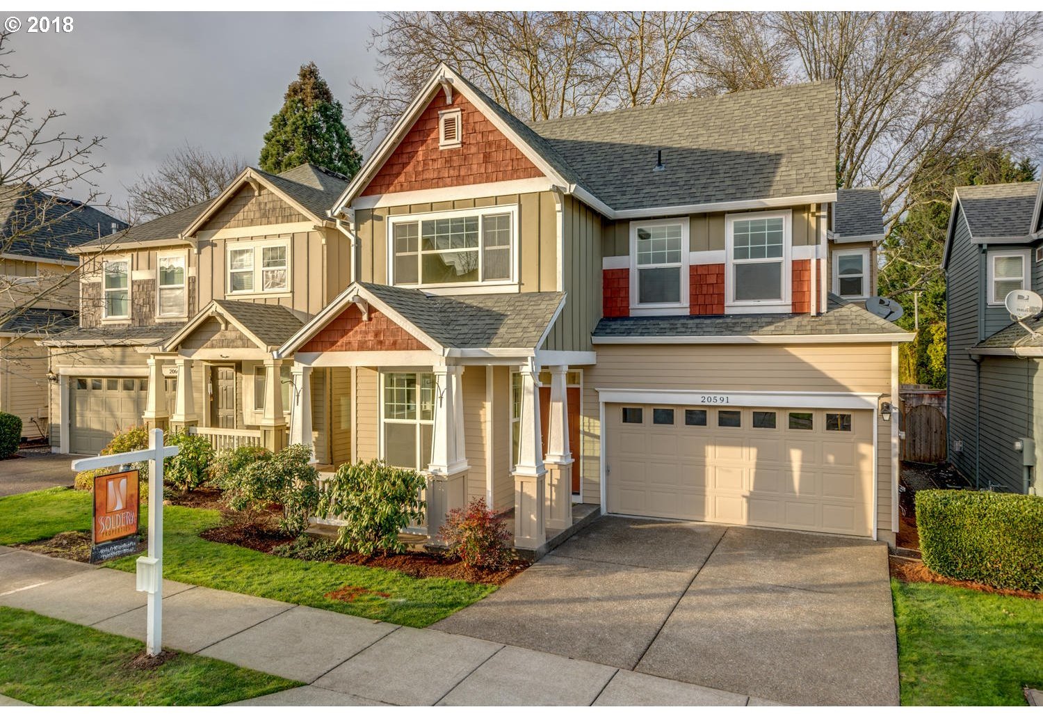 20591 Southwest Ravenswood Street Beaverton, OR 97078 - Photo 2 of 31 a front view of a house with garden