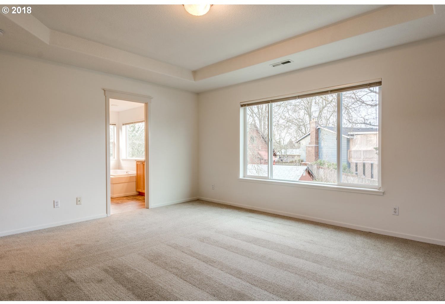 20591 Southwest Ravenswood Street Beaverton, OR 97078 - Photo 22 of 31 a view of an empty room with a window