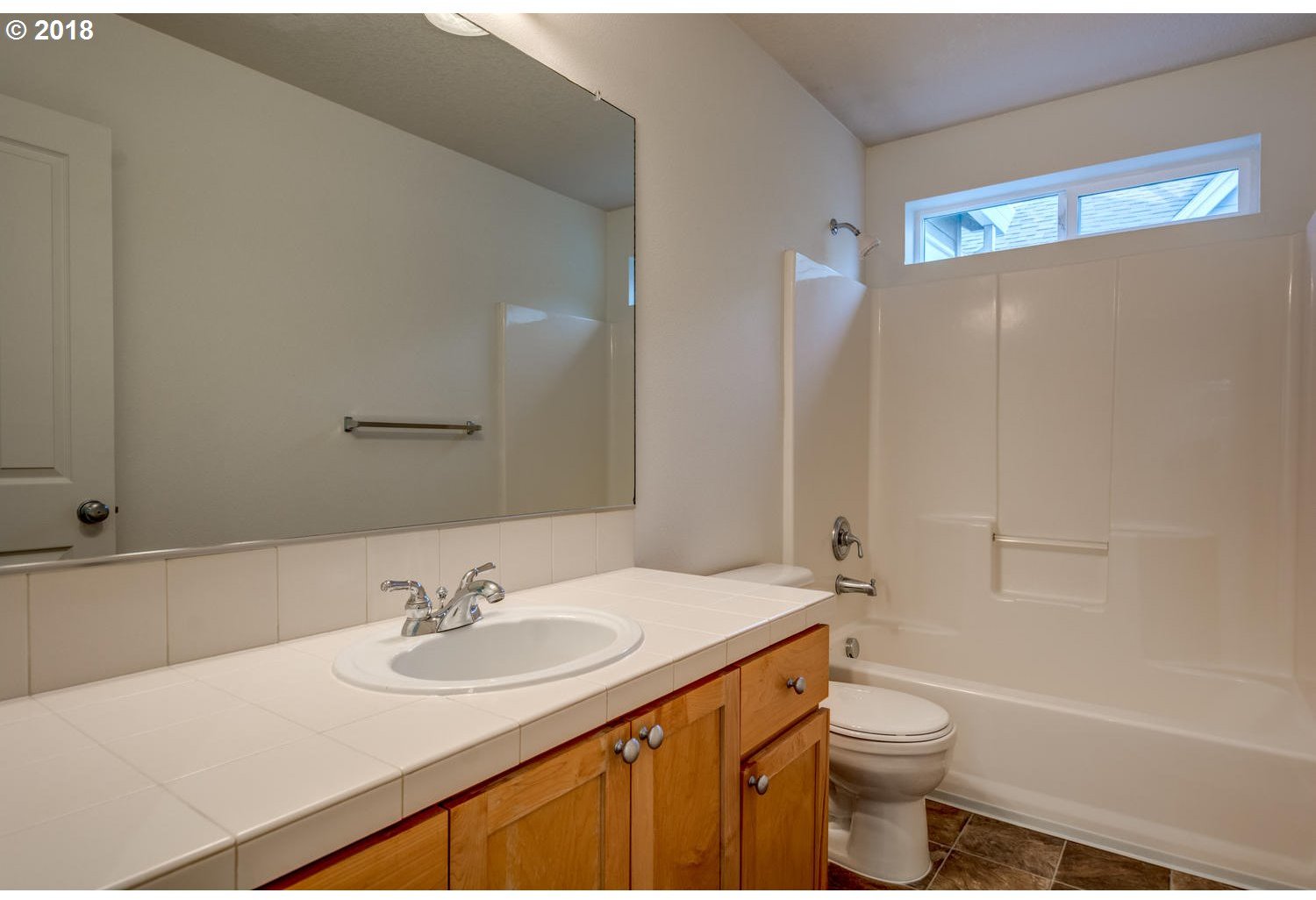 20591 Southwest Ravenswood Street Beaverton, OR 97078 - Photo 29 of 31 a bathroom with a sink and a mirror