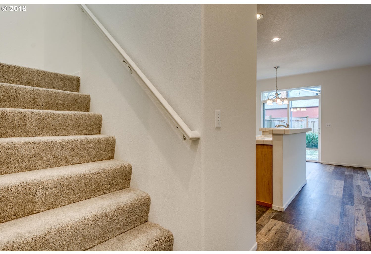 20591 Southwest Ravenswood Street Beaverton, OR 97078 - Photo 10 of 31 a view of entryway and hall with wooden floor