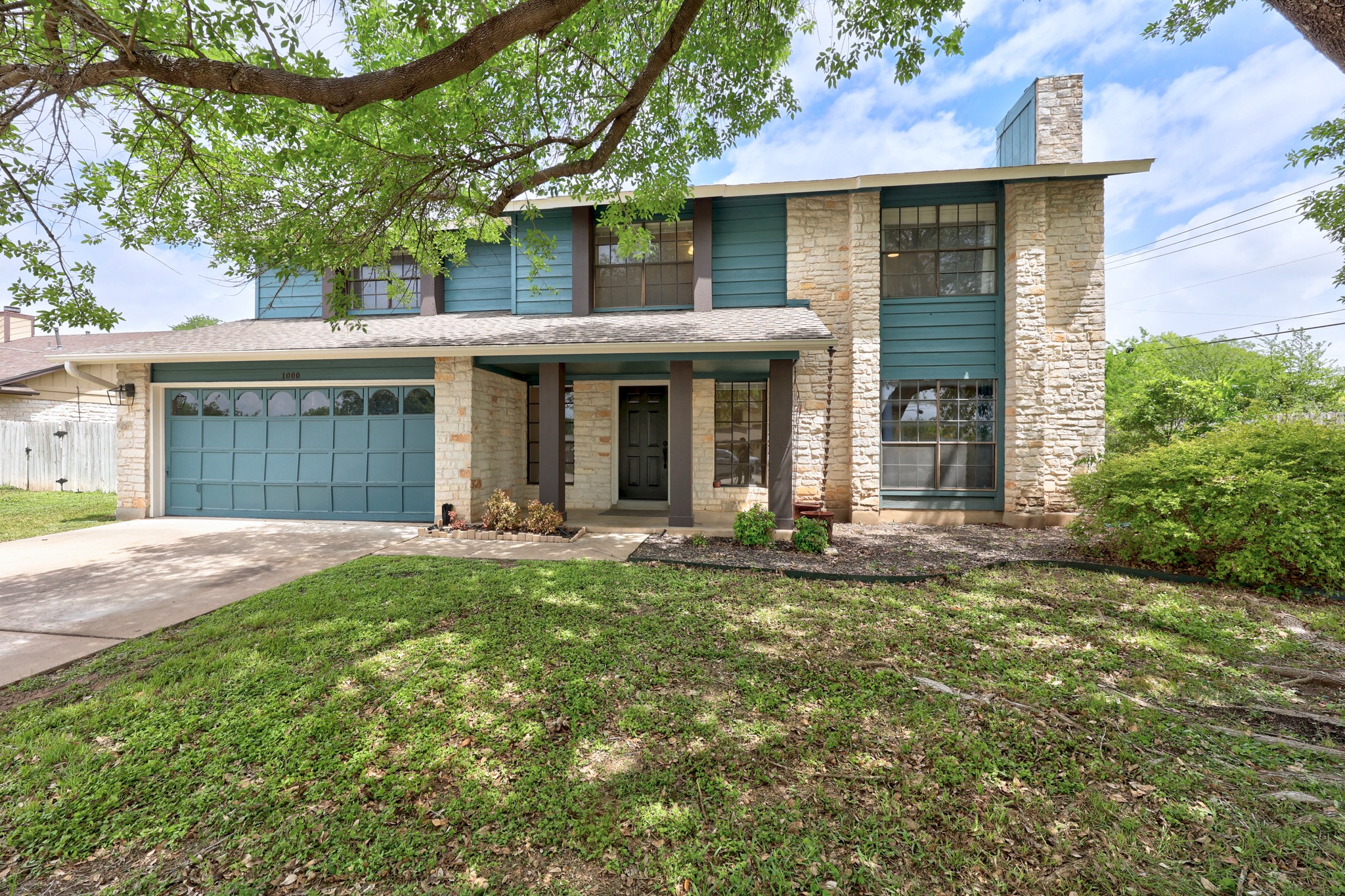 1000 West Noton Street Pflugerville, TX 78660 - Photo 2 of 35 a front view of a house with yard patio and green space