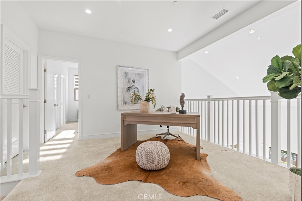 113 Halworth Irvine, CA 92618 - Photo 17 of 30 a hallway with a potted plant and two windows