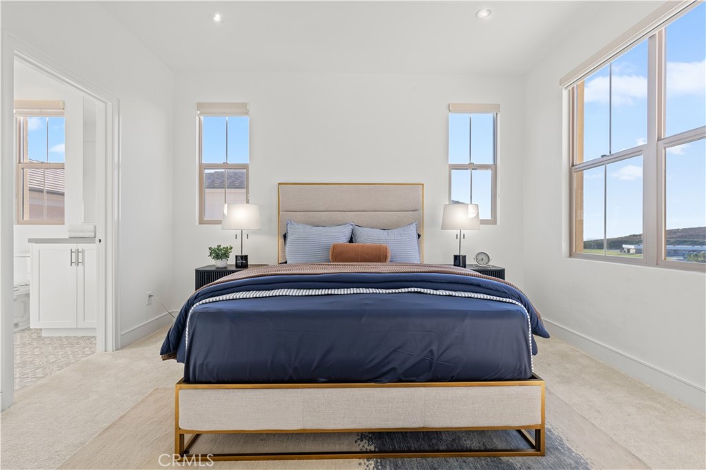 113 Halworth Irvine, CA 92618 - Photo 23 of 30 a bedroom with a bed and windows