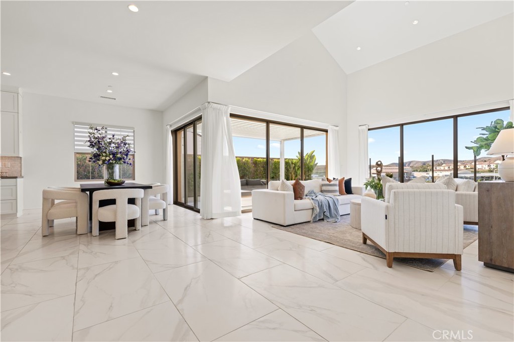 113 Halworth Irvine, CA 92618 - Photo 6 of 30 a living room with furniture and large windows