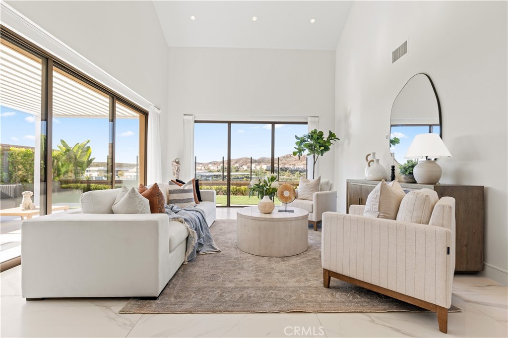 113 Halworth Irvine, CA 92618 - Photo 7 of 30 a living room with furniture and a large window