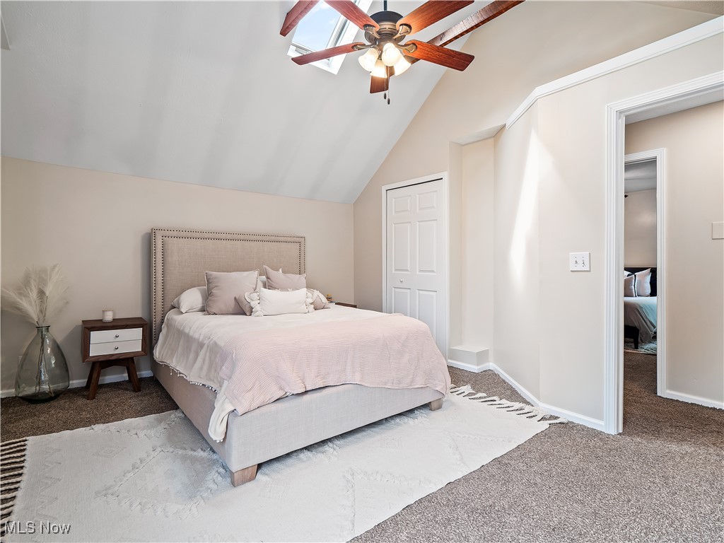 1727 Randall Road Cleveland, OH 44113 - Photo 26 of 40 Bedroom with carpet floors, vaulted ceiling, ceiling fan, and a closet