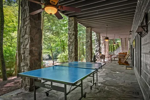 a dining area with furniture and wooden floor