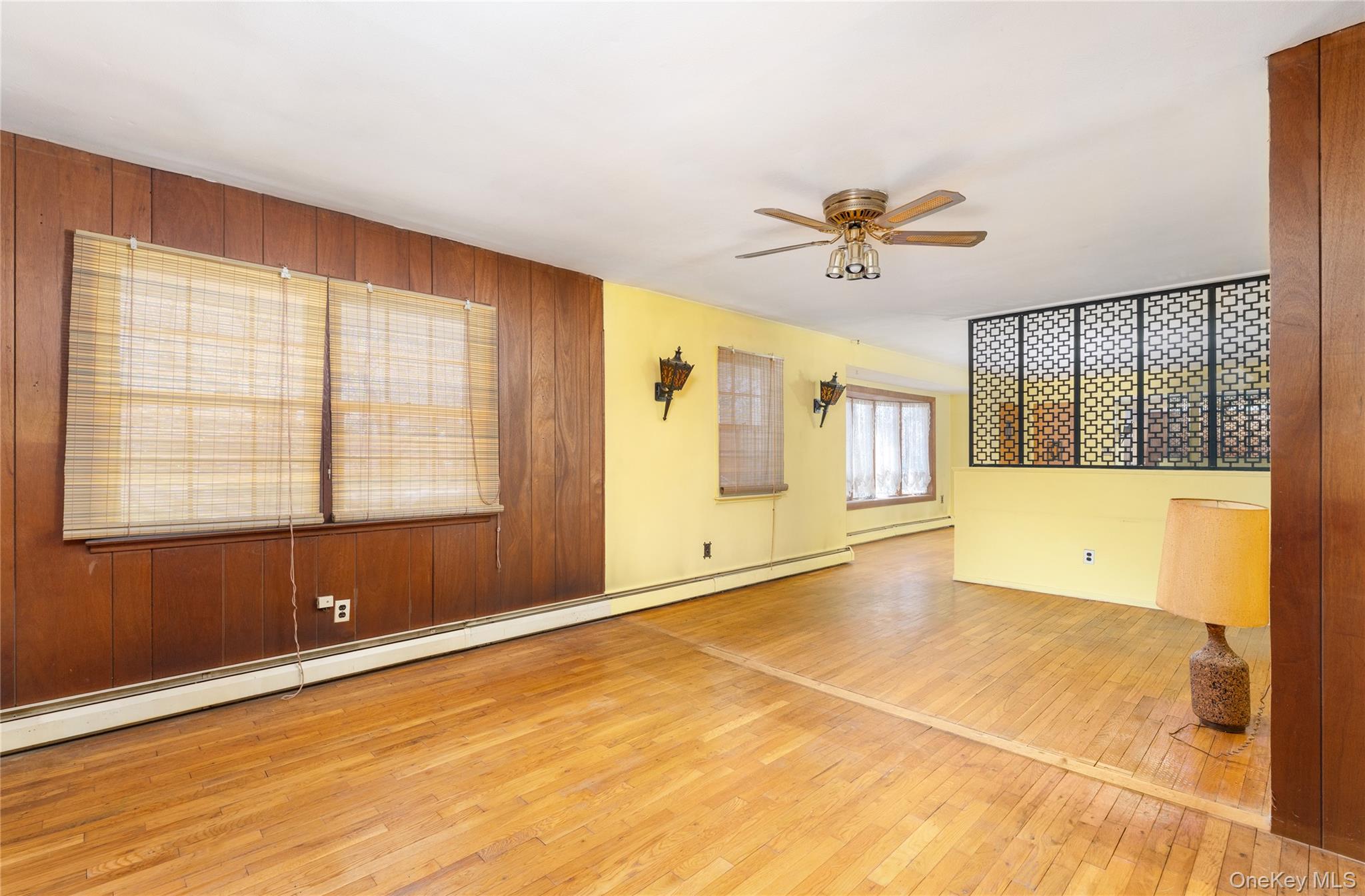 52 Woodbury Road Farmingville, NY 11738 - Photo 5 of 25 Wood floors, ceilinhg fan