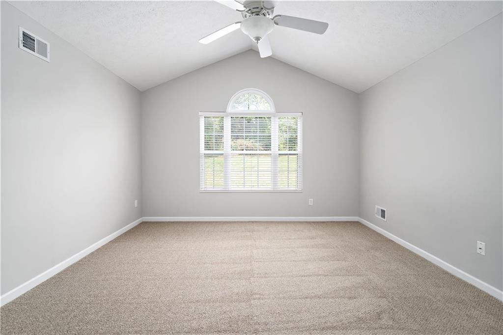 179 Rana Lane Gibsonia, PA 15044 - Photo 17 of 25 an empty room with a window and a fan