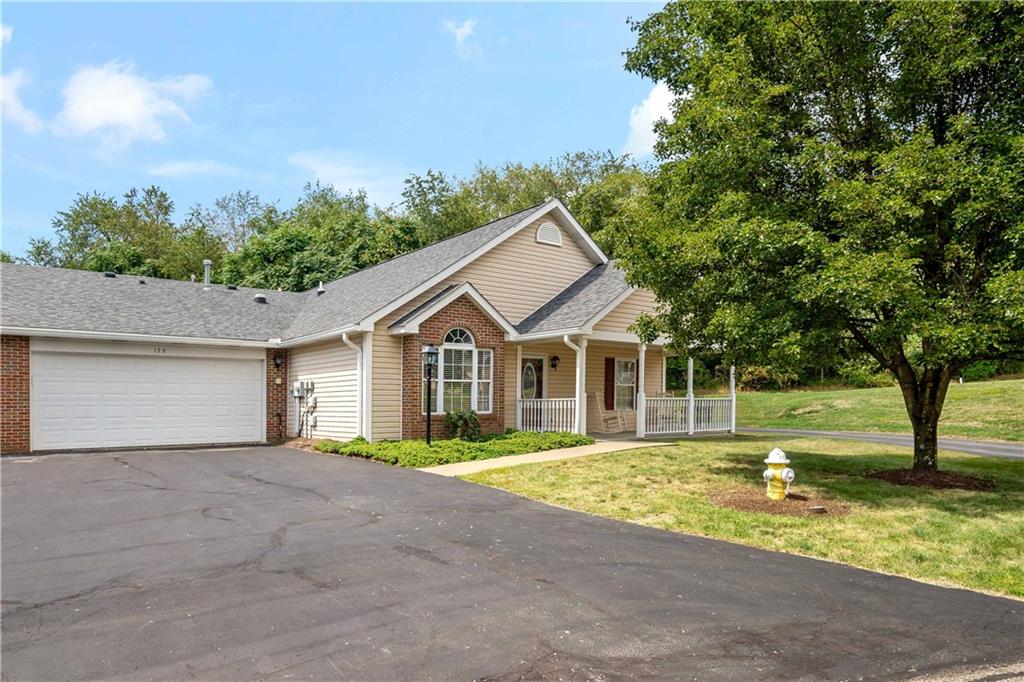 179 Rana Lane Gibsonia, PA 15044 - Photo 2 of 25 a front view of a house with a yard and garage