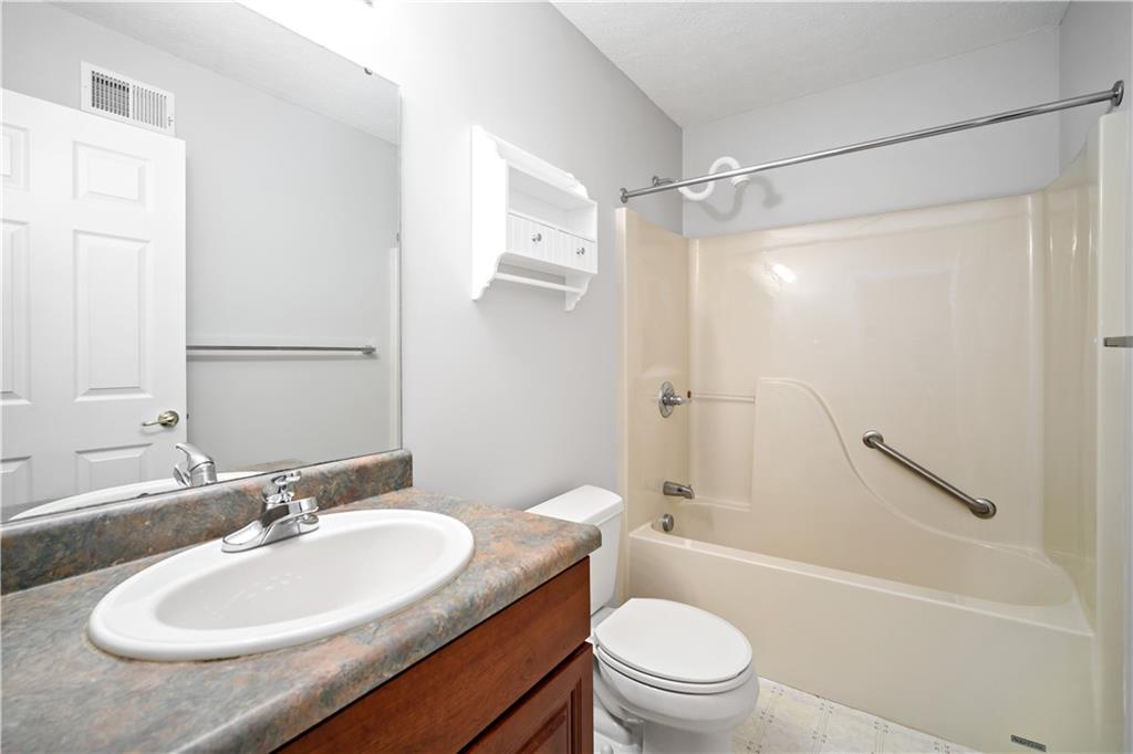 179 Rana Lane Gibsonia, PA 15044 - Photo 22 of 25 a bathroom with a granite countertop sink toilet and shower