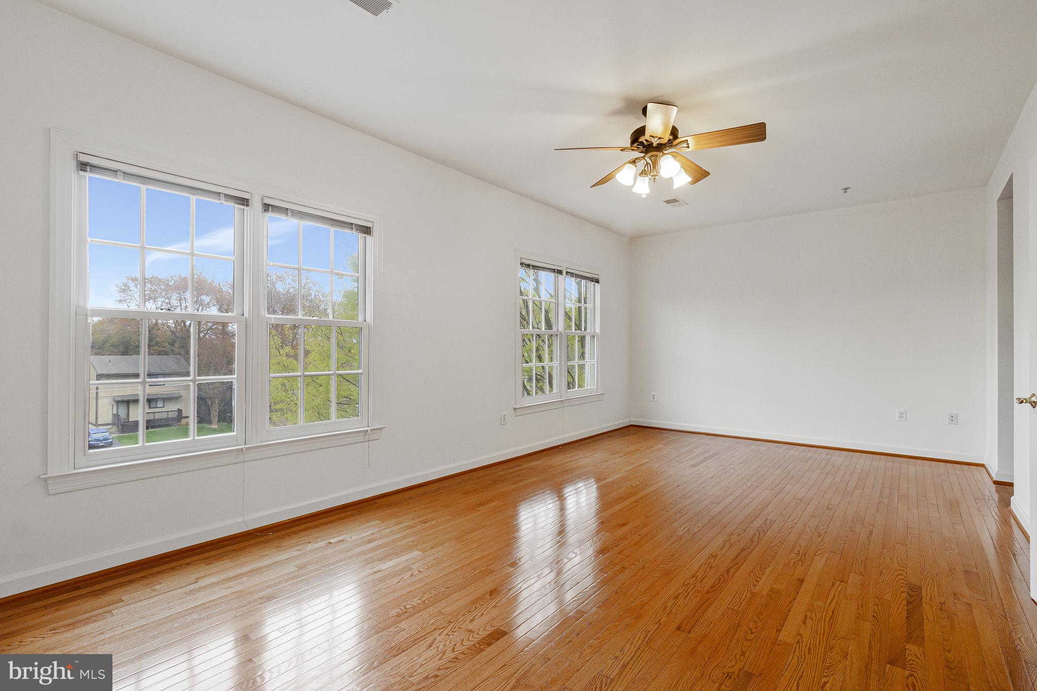 1646 Colonial Hills Drive McLean, VA 22102 - Photo 19 of 39 a view of an empty room with a window and wooden floor