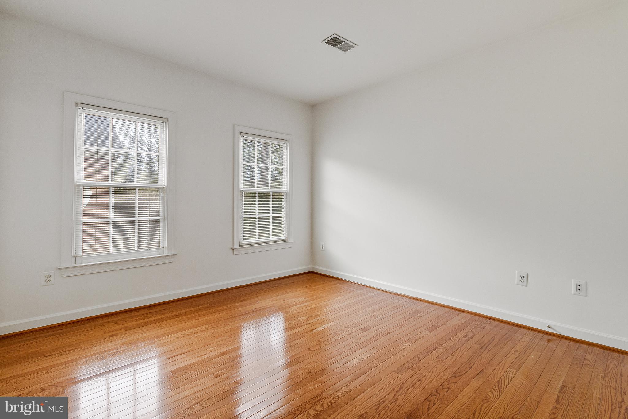 1646 Colonial Hills Drive McLean, VA 22102 - Photo 23 of 39 an empty room with wooden floor and windows
