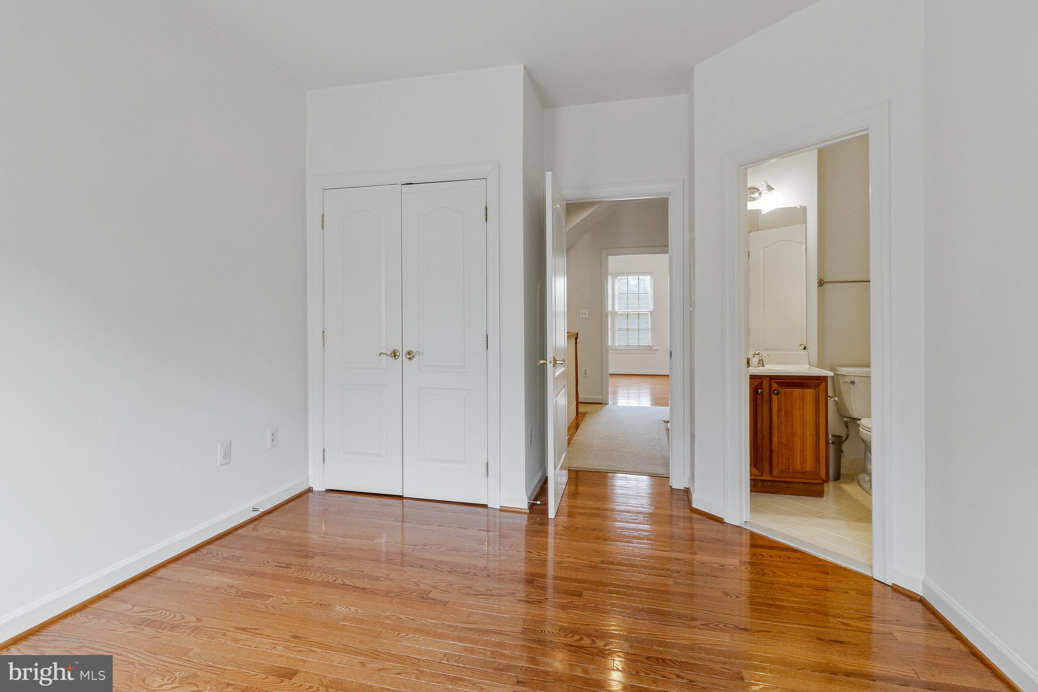 1646 Colonial Hills Drive McLean, VA 22102 - Photo 24 of 39 a view of a hallway with wooden floor and a bathroom