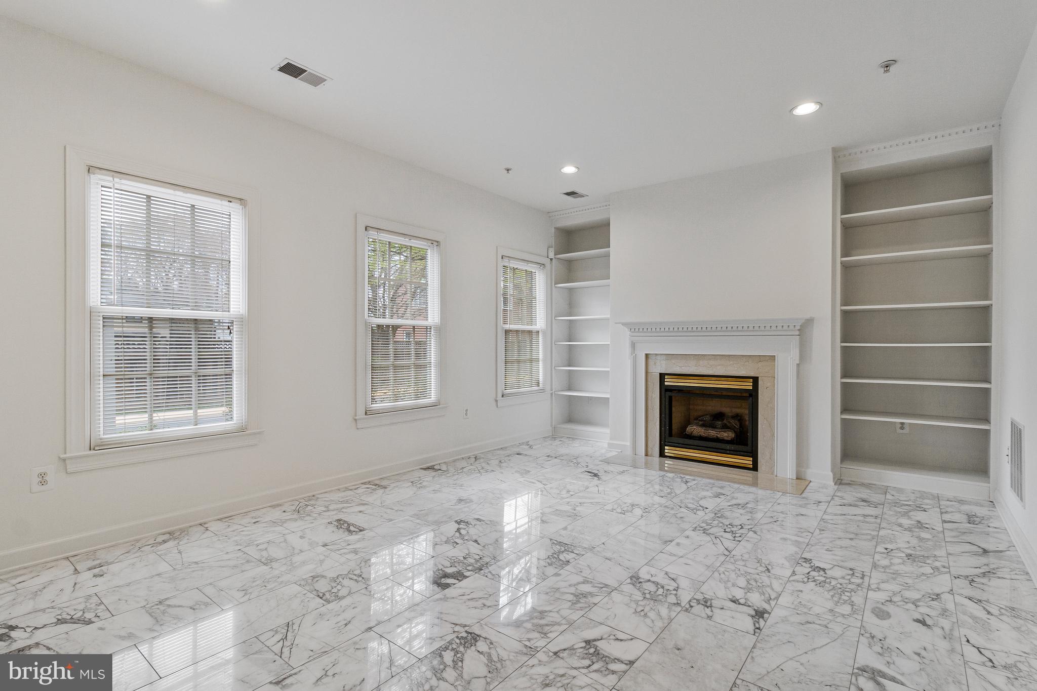 1646 Colonial Hills Drive McLean, VA 22102 - Photo 6 of 39 a view of an empty room with a fireplace and a window