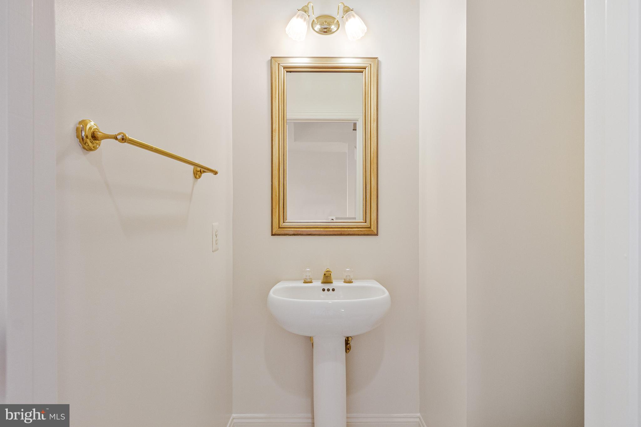 1646 Colonial Hills Drive McLean, VA 22102 - Photo 9 of 39 a bathroom with a sink and a mirror