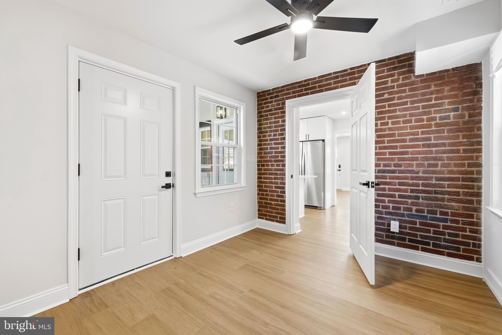 334 Nicholson Street Northeast Washington, DC 20011 - Photo 8 of 23 In-Law entryway with exposed brick accents.