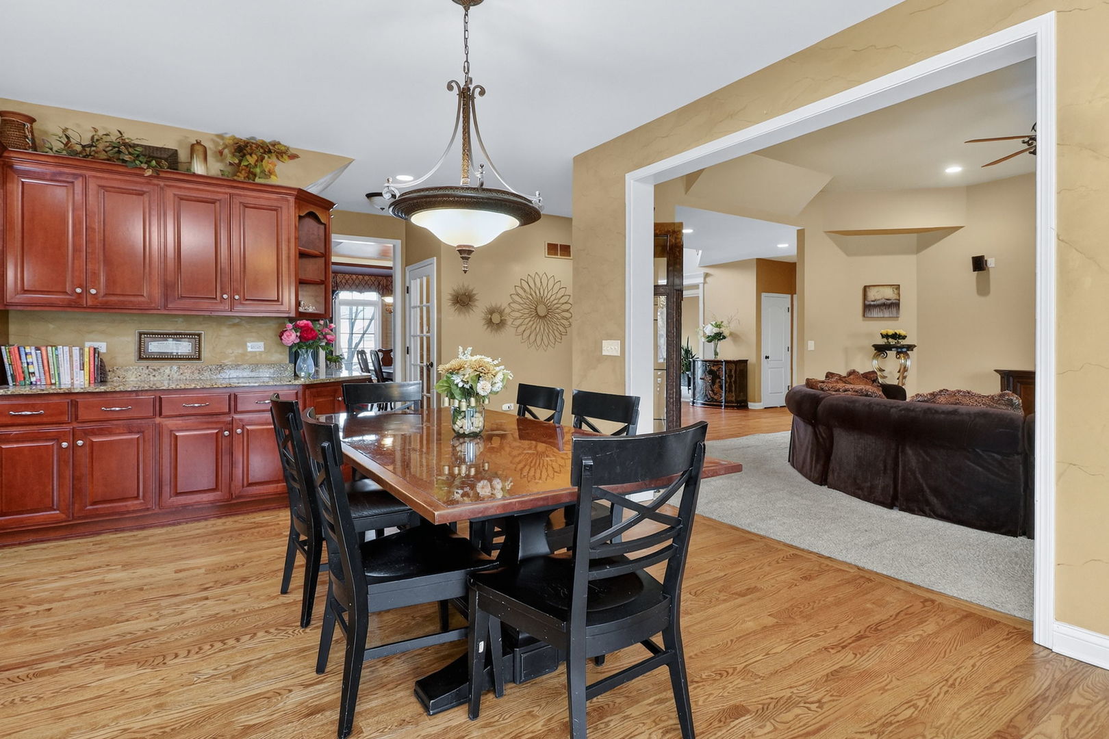 1 Crenshaw Court Bolingbrook, IL 60490 - Photo 12 of 56 a view of a dining room with furniture and wooden floor
