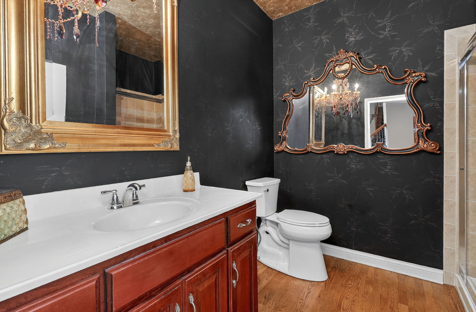 1 Crenshaw Court Bolingbrook, IL 60490 - Photo 21 of 56 a bathroom with a sink a toilet and a mirror