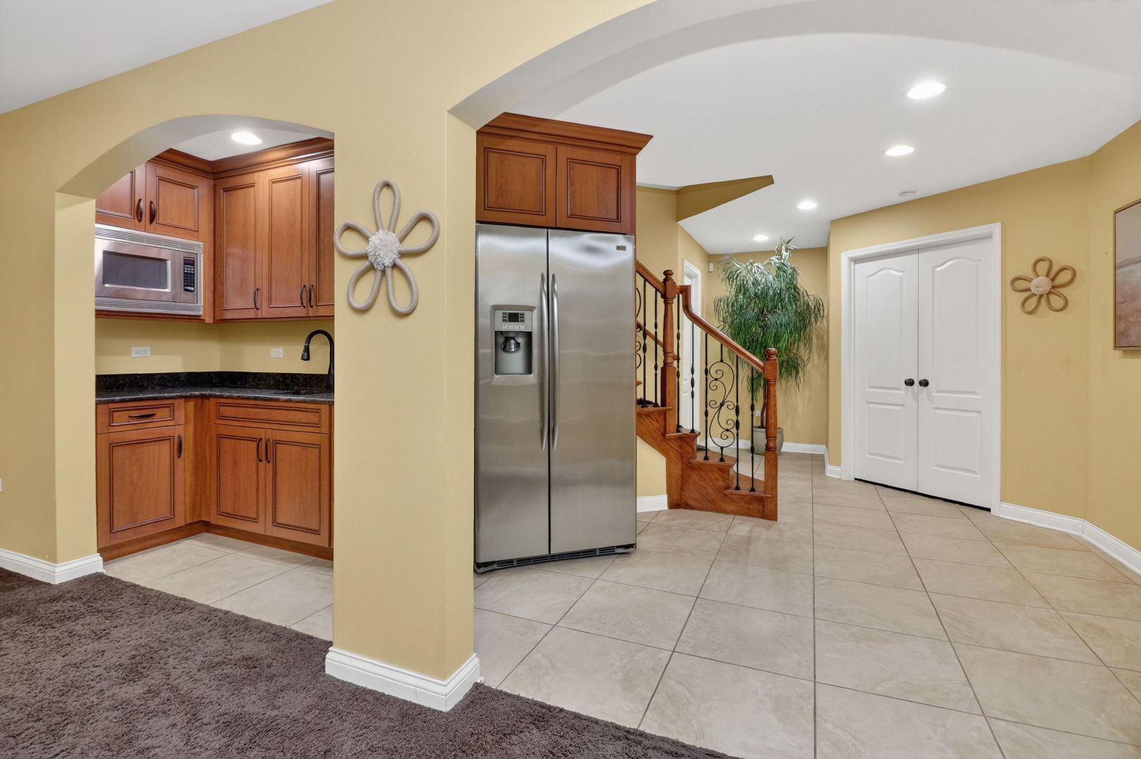 1 Crenshaw Court Bolingbrook, IL 60490 - Photo 40 of 56 a kitchen with stainless steel appliances granite countertop a refrigerator and a stove