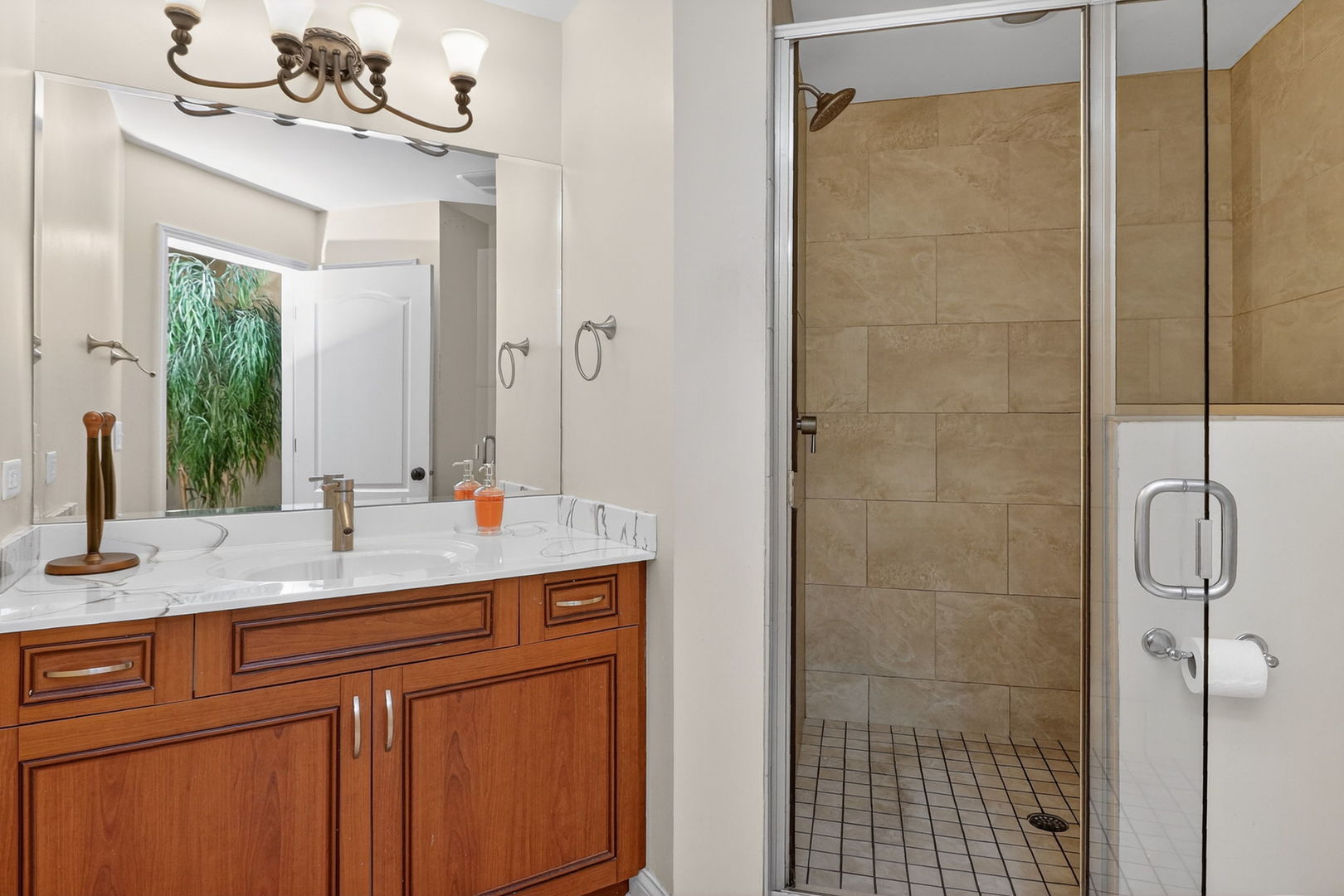 1 Crenshaw Court Bolingbrook, IL 60490 - Photo 48 of 56 a bathroom with a granite countertop sink a mirror and shower