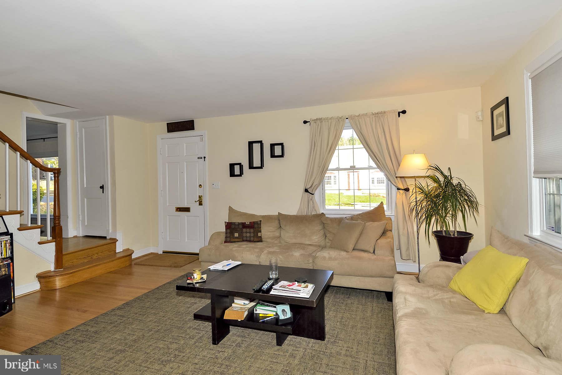 110 Normandy Drive Silver Spring, MD 20901 - Photo 2 of 20 a living room with furniture and a wooden floor
