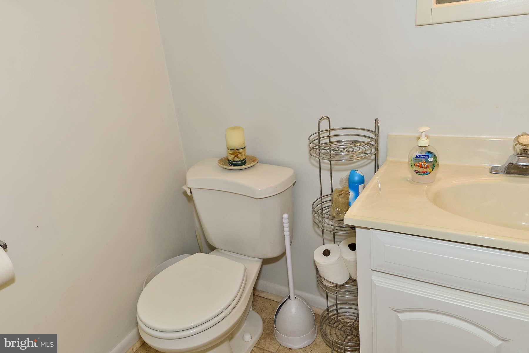 110 Normandy Drive Silver Spring, MD 20901 - Photo 12 of 20 a white toilet sitting next to a bathroom sink