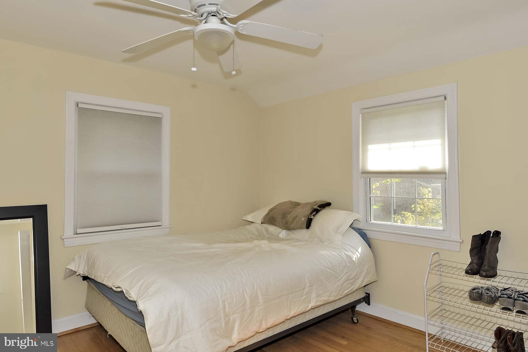 110 Normandy Drive Silver Spring, MD 20901 - Photo 14 of 20 a bedroom with a bed and a window