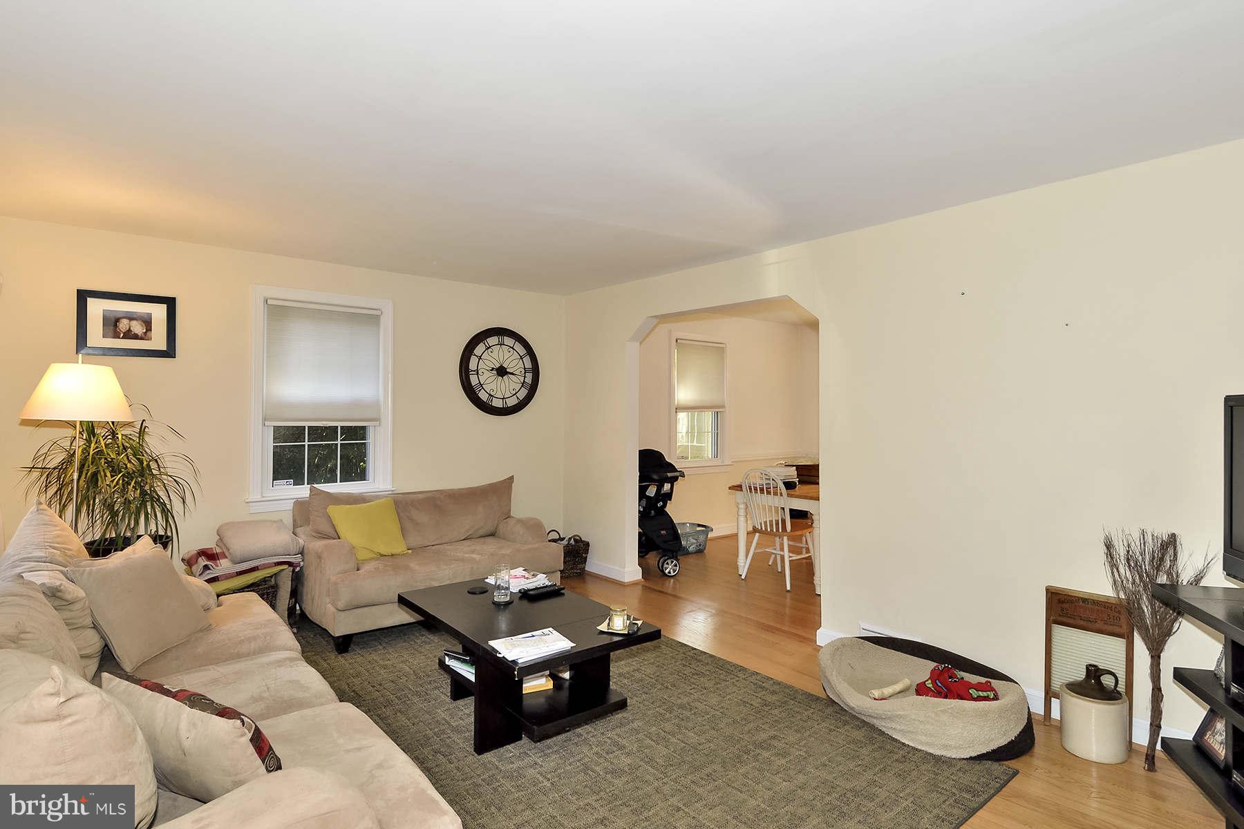 110 Normandy Drive Silver Spring, MD 20901 - Photo 3 of 20 a living room with furniture and a table