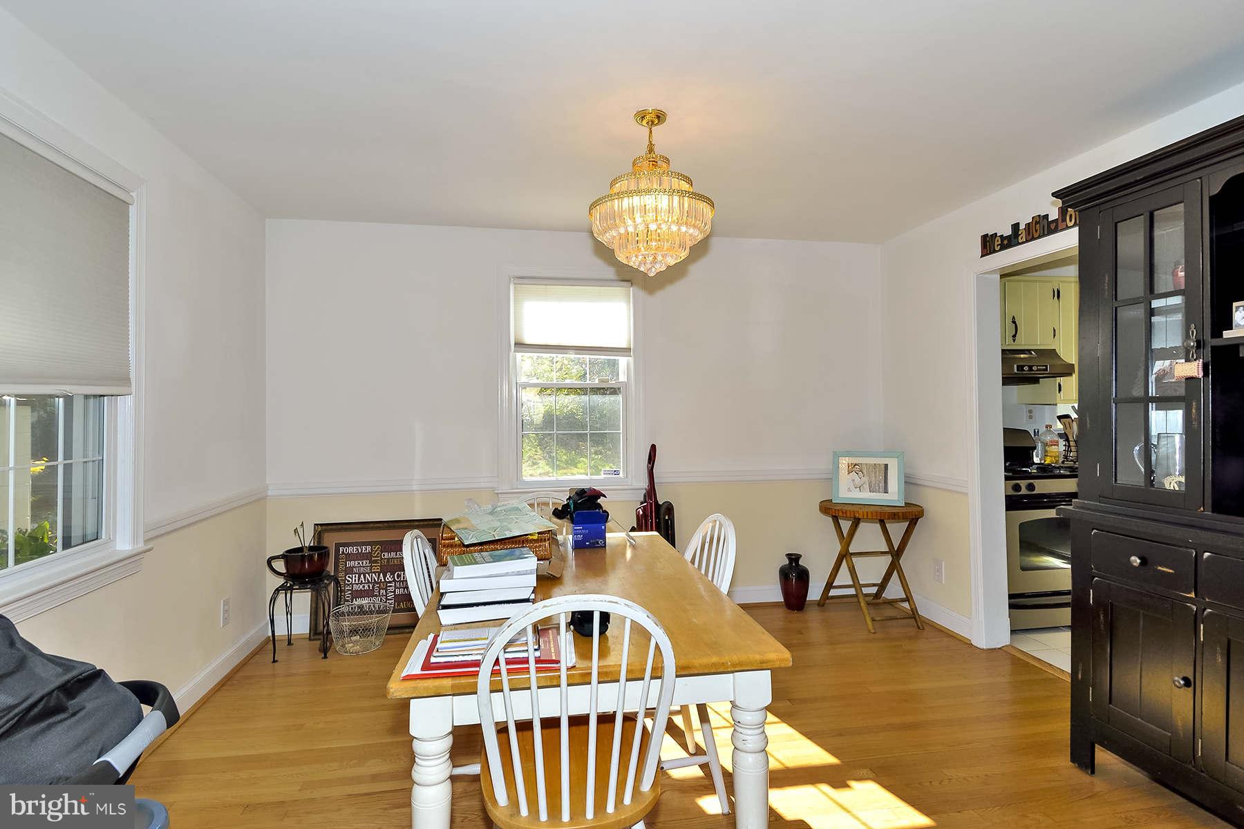 110 Normandy Drive Silver Spring, MD 20901 - Photo 5 of 20 a bedroom with furniture and a large window