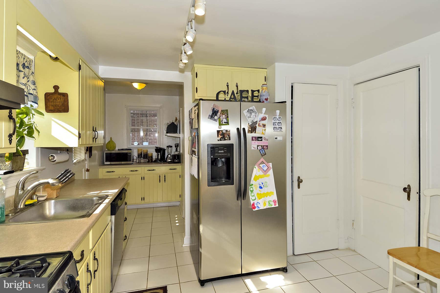 110 Normandy Drive Silver Spring, MD 20901 - Photo 6 of 20 a kitchen with stainless steel appliances granite countertop a refrigerator and a sink