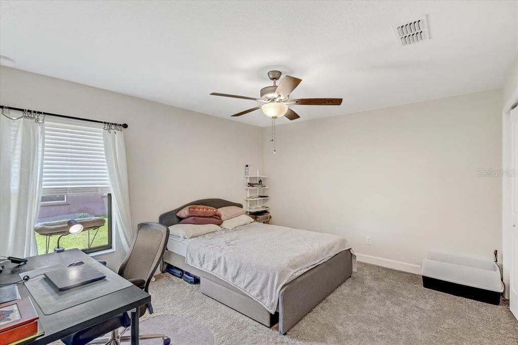 7314 Madrid Road Weeki Wachee, FL 34613 - Photo 22 of 54 a bedroom with a bed and window